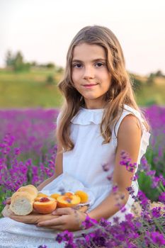 A child in a lavender field. Selective focus. Nature.