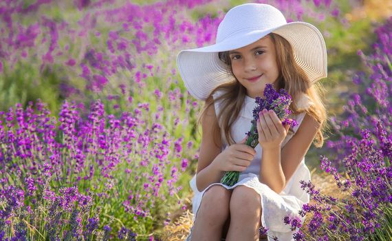 A child in a lavender field. Selective focus. Nature.