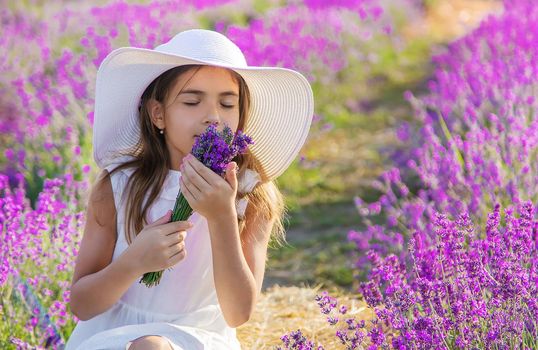 A child in a lavender field. Selective focus. Nature.