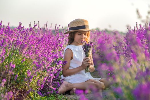 A child in a lavender field. Selective focus. Nature.
