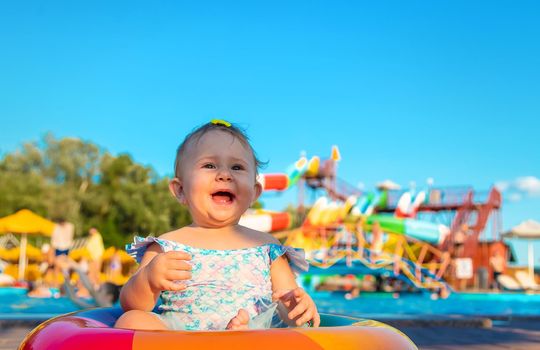 Baby with a circle near the pool. Selective focus. Child.