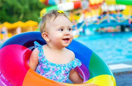 Baby with a circle near the pool. Selective focus. Child.