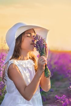 A child in a lavender field. Selective focus. Nature.