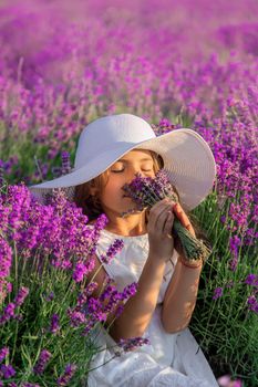 A child in a lavender field. Selective focus. Nature.