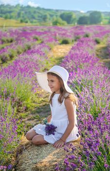 A child in a lavender field. Selective focus. Nature.