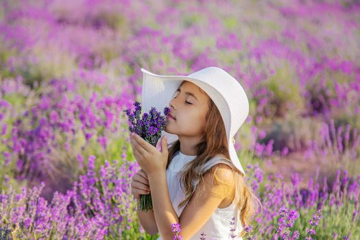A child in a lavender field. Selective focus. Nature.