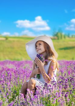 A child in a lavender field. Selective focus. Nature.