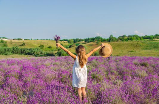 A child in a lavender field. Selective focus. Nature.