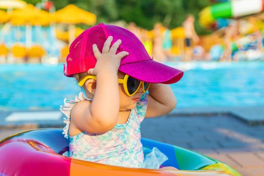 Baby with a circle near the pool. Selective focus. Child.