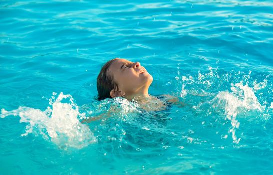 The child is drowning in water. Selective focus. Kid.