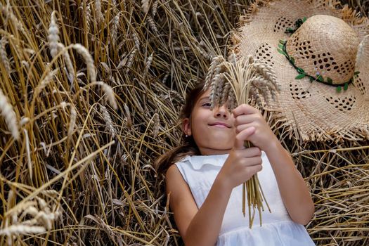 A child in a wheat field. Selective focus. Nature.