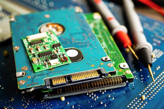 Asian Technician repairing micro circuit main board computer electronic technology, hardware, mobile phone, upgrade, cleaning concept.
