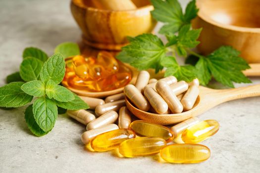 Alternative medicine herbal organic capsule with vitamin E omega 3 fish oil, mineral, drug with herbs leaf natural supplements for healthy good life.
