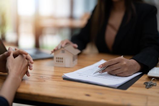 Real estate agent offer hand for customer sign agreement contract signature for buy or sell house. Real estate concept contact agreement concept.