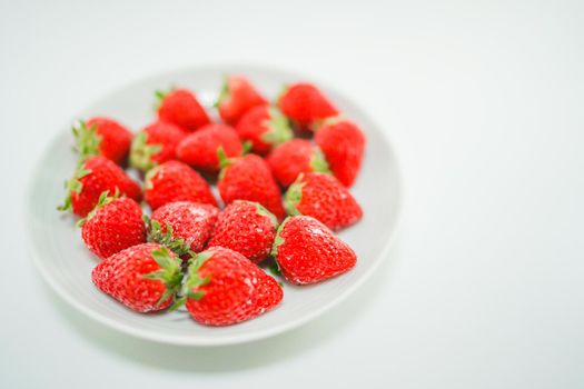 Frozen strawberries and white dishes. Shooting Location: Yokohama-city kanagawa prefecture