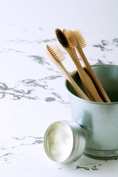 bamboo teeth brushes in bathroom on marbel background . High quality photo