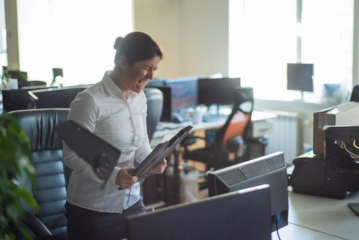 A woman freaks out and gets depressed from a mistake and breaks the keyboard on the monitor. Female manager gets angry and crashes a computer. Office clerk is stressed at work. Unstable psyche