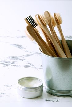 bamboo teeth brushes in bathroom on marbel background with copy space. High quality photo