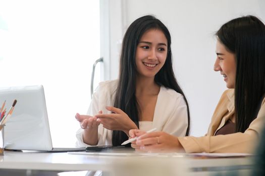 Businesswoman teamwork meeting to discuss the investment. Business people talking together with laptop computer at office.