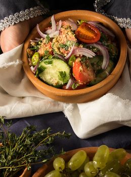 A vertical picture of a dish in hands