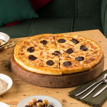 A closeup of freshly-baked pizza on a table
