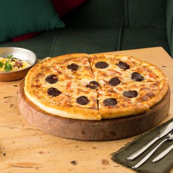 A closeup of freshly-baked pizza on a table