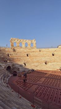 Verona, Italy - March 19, 2022: Beautiful photography of the Arena at Piazza Brà in Verona, a famous Roman amphitheater. Macro view of the old construction by day.