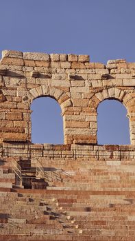 Verona, Italy - March 19, 2022: Beautiful photography of the Arena at Piazza Brà in Verona, a famous Roman amphitheater. Macro view of the old construction by day.