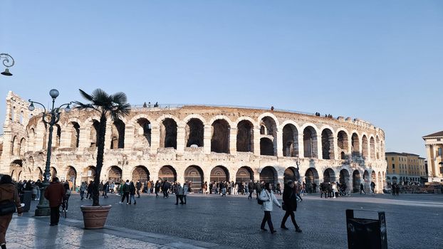 Verona, Italy - March 19, 2022: Beautiful photography of the Arena at Piazza Brà in Verona, a famous Roman amphitheater. Macro view of the old construction by day.