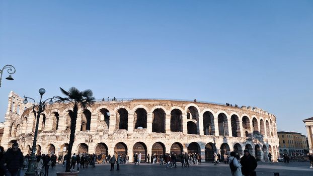 Verona, Italy - March 19, 2022: Beautiful photography of the Arena at Piazza Brà in Verona, a famous Roman amphitheater. Macro view of the old construction by day.