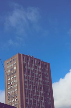 Genova, Italy-January 29, 2022: Beautiful modern high-rise buildings against the sky. 3d illustration on the theme of business success and technology. clouds reflection on the mirror.Industrial zone.