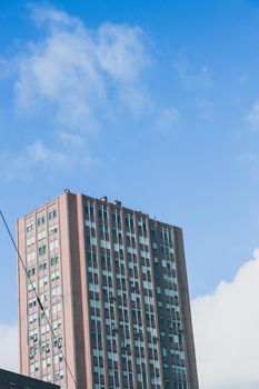 Genova, Italy-January 29, 2022: Beautiful modern high-rise buildings against the sky. 3d illustration on the theme of business success and technology. clouds reflection on the mirror.Industrial zone.