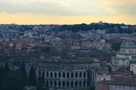 Verona, Italy-March 19, 2022: Beautifull old buildings of Verona. Typical architecture of the medieval period. Aerial view to the city with blue sky in the background. Detailed photography of the old architecture.