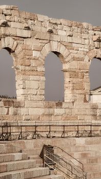 Verona, Italy-March 19, 2022: Beautifull old buildings of Verona. Typical architecture of the medieval period. Aerial view to the city with blue sky in the background. Detailed photography of the old architecture.