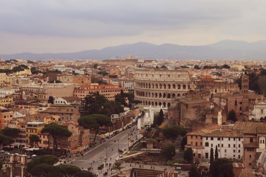 ROME, ITALY - February 05, 2022: Panoramic view of inside part of Colosseum in city of Rome, Italy. Cold and gray sky in the background. Macro photography of the arches.