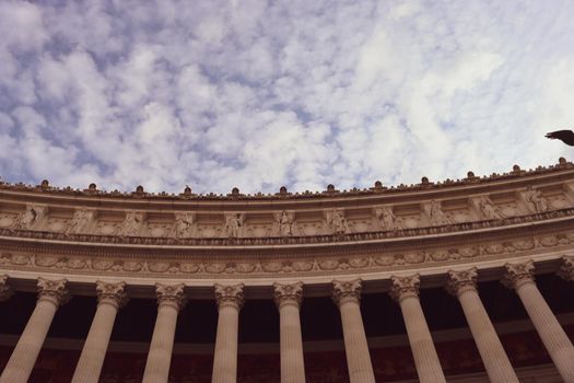 ROME, ITALY - February 05, 2022: Panoramic view of inside part of Colosseum in city of Rome, Italy. Cold and gray sky in the background. Macro photography of the arches.