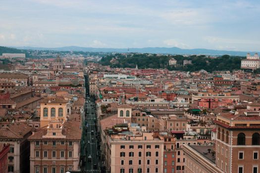 ROME, ITALY - February 05, 2022: Panoramic view of inside part of Colosseum in city of Rome, Italy. Cold and gray sky in the background. Macro photography of the arches.