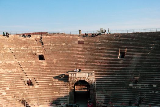 Verona, Italy - March 19, 2022: Beautiful photography of the Arena at Piazza Brà in Verona, a famous Roman amphitheater. Macro view of the old construction by day.