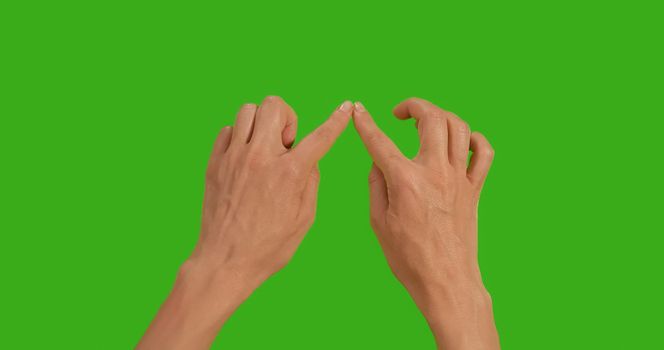 Gestures female Hand, the symbol of love on a Green Background, Green Screen, Chroma Key Close-up. Make symbols with hand on Greenscreen.