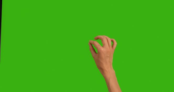 Close Up Hand Touching, Clicking, Tapping, Swiping on Chroma Key Green Background, like using a Smartphone, Tablet Pc or a Touchscreen. Hand gestures. Zoom,