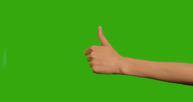 Gestures female Hand OKAY OK CLASS Everything is Good on a Green Background, Green Screen, Chroma Key Close-up. Make symbols with hand on Greenscreen.