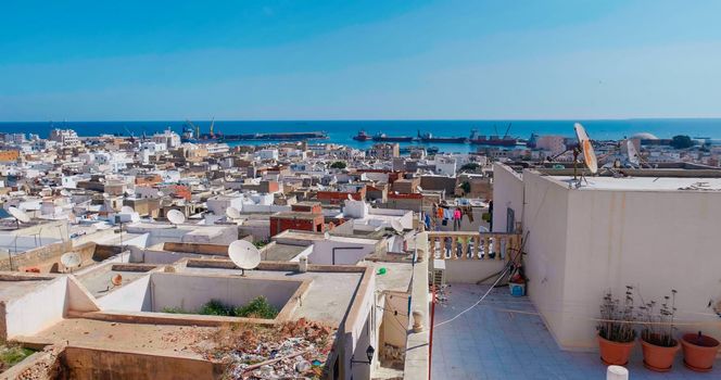 Sousse Port, Tunisia. View of port from city building. Port area with buildings, houses, cargo warehouses.