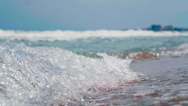 Close up sea, ocean waves. View from Seashore, blue sky, summer landscape at the sea. Blue, clear water