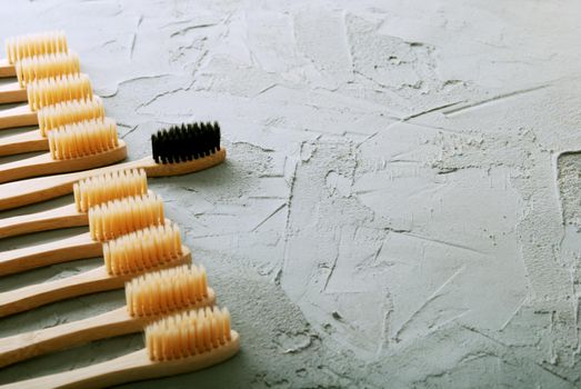 bamboo toothbrushes on a concrete background with copy space. High quality photo