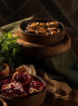 A shot of a dish and pomegranates