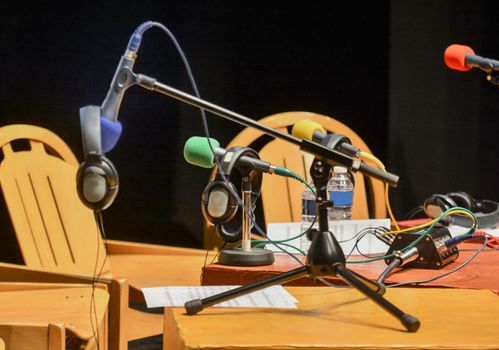 Microphones and headphones are prepared for interviews