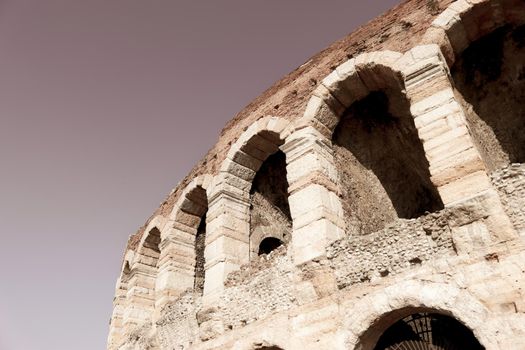 Verona, Italy - March 19, 2022: Beautiful photography of the Arena at Piazza Brà in Verona, a famous Roman amphitheater. Macro view of the old construction by day.