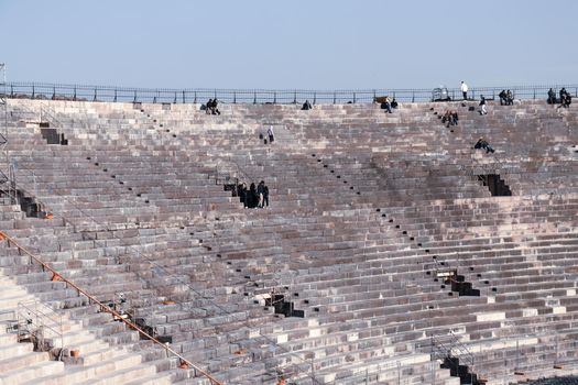 Verona, Italy - March 19, 2022: Beautiful photography of the Arena at Piazza Brà in Verona, a famous Roman amphitheater. Macro view of the old construction by day.