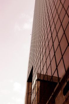 Genova, Italy-January 29, 2022: Beautiful modern high-rise buildings against the sky. 3d illustration on the theme of business success and technology. clouds reflection on the mirror.Industrial zone.