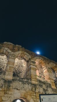 Verona, Italy - March 19, 2022: Beautiful photography of the Arena at Piazza Brà in Verona, a famous Roman amphitheater. Macro view of the old construction by day.